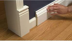 Install Wide Baseboard Molding Over