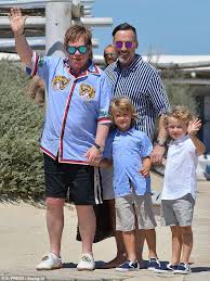 Elton john has paid an emotional tribute to his sons zachary and elijah while sharing a photo of the youngsters on their first day of school. Elton John Take Sons For Annual St Tropez Lunch Daily Mail Online