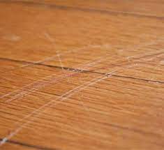 Deep scratches over 1/8 inches deep in wood flooring are the type of gouging that occurs from dog claws or by sliding heavy furniture or appliances across the floor. Flooring Tips Tricks Minimize Scratches Dents On Hardwood