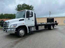 To safely tow a car you must have the proper equipment, including a capable pickup truck and the right towing equipment for the ty. Hino 258 Rollback Flatbed Tow Truck Wrecker Wheel Lift Low Vans Suvs And Trucks Cars