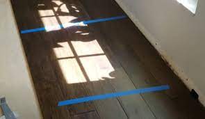 install hardwood flooring over tile