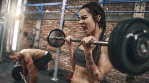 women lift heavy weights