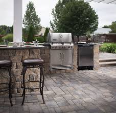 A fully equipped kitchen is nestled into the landscaping to allow for dining while enjoying nature. Outdoor Barbecue Islands Design Ideas Tips Install It Direct
