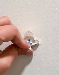 how to fix a hole in the wall yourself