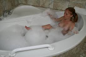 Teen Young Petite Redhead Alyssa Hart with Pigtails in Bathtub.