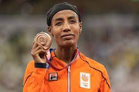 Sifan hassan of the netherlands crosses the finish line to win the women's 5,000 meters at the tokyo olympics. Dxiwjjt1fima6m