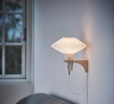 Direct lighting is also essential when reading, and especially when doing desk work since insufficient lighting causes strain on the eyes. Wall Light Mushroom White L27cm H24cm Le Klint Nedgis Lighting