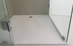 install a shower base on concrete floor