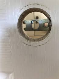 A small or thin screwdriver will work best on interior doors or doors with privacy handles. How To Open A Door That Has The Insides Of A Door Handle Inside Without A Door Knob Home Improvement Stack Exchange