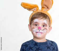 boy child face painted easter bunny
