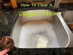 clear a sink clogged past the trap in