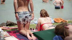 Girl starts undressing in beach, stock v... | Stock Video | Pond5
