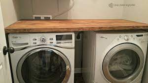 Having a countertop over your washer and dryercan help to organize your laundry room. Diy Laundry Room Countertop For Under 40 Down Home Inspiration