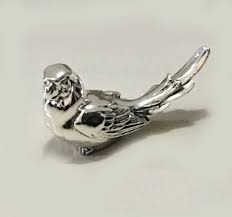 silver parrot gift in a sitting pose