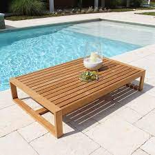 The coffee table is made of naturally durable teak and woven all weather wicker. Modern Teak Coffee Table Casita Rectangular Coffee Table