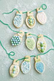 Plate with christmas gingerbread cookies decorated with wreath made of rosemary on white table. 64 Christmas Cookie Recipes Decorating Ideas For Sugar Cookies