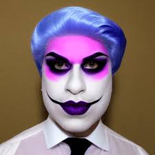 a drag king in white face makeup