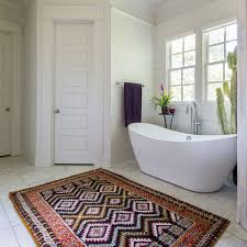 Because they help to absorb water when you step out of the tub, some would say this accessory is essential. Look We Love Using Real Rugs In The Bathroom Apartment Therapy