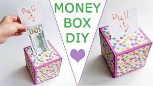 Place some ribbon or tissue paper on top of the roll of bills, and then fold over the pull tag so you can see it on top of the ribbon. Wow Money Box Surprise Your Family And Friends Dollar Idea Craft Gift Tutorial Diy Youtube