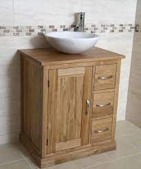 oak vanity unit with round marble sink