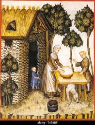 Préparation du beurre dans le Moyen Âge d'une miniature Photo Stock - Alamy