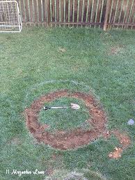 The other thing to note is that you'll want those holes to be cleared of any ash or debris. How To Build A Diy A Backyard Fire Pit 11 Magnolia Lane