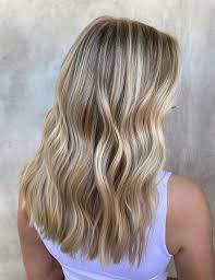 The best thing is that you can wear it sleek and straight or create locks on the flip side, women with wavy hair tend to straighten it in order to switch things up a little bit. 25 Medium Blonde Hairstyles To Show Your Stylist Pronto Southern Living