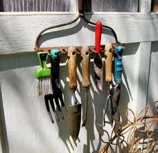 Creating a garden tool rack for stashing stuff in the unused spaces between studs is a smart move; Diy Vs Paid 17 Garden Tool Organizer Solutions