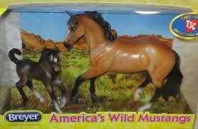 This 4 ¾ inch mustang mare is a buckskin color, which refers to tan or yellow horses. Sandy Bay Mustang Mare And Grullo Foal Breyer Value Guide