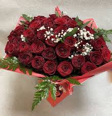 50 red roses by blossom florists in es