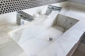 white marble trough sink with two