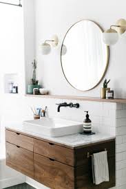 Large round mirrors can be a statement piece in every room in the house, adding a stunning chic factor to entryways, living rooms, bathrooms, and bedrooms alike. Round Bathroom Mirror Inspirations Shopping Picks Apartment Therapy