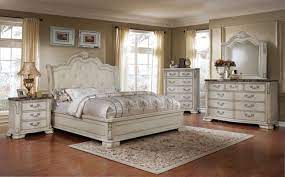 Warm antique finishes and artistic distressing along with grand scale a group to be passed to generations. Magnolia Traditional California King Panel Bed 4pc Bedroom Set Antique White