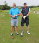 Two Golfers Standing On A Tee Box With Drivers In Hand,on A Golf ...