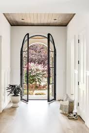 Home With Steel And Glass Arch Doors