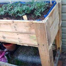 diy raised garden bed using pallets