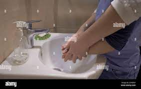 Washing hands with mother. Mom helps her son wash his hands after shopping.  Hygiene concept. Pandemic concept. Close up shot Stock Photo - Alamy