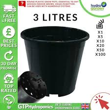 4 black plastic plant pots plus 3