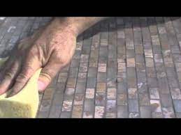 how to remove grout and cement residues