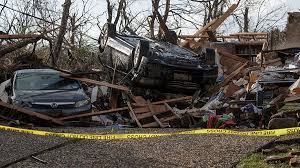at least 26 dead after tornadoes rake