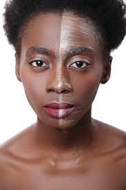 black woman with half face on makeup