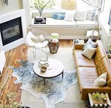 how to layer cowhide rugs cactus