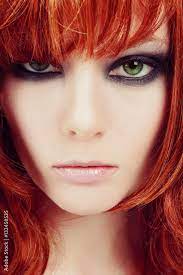 red hair and stylish smoky eyes makeup
