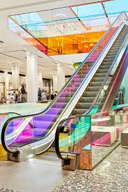 oma adds iridescent gl escalator to
