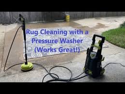 cleaning rug with a pressure washer