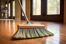 sweeping bamboo flooring with a