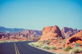 photo of rugged landscape with road