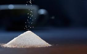 mere granulated sugar with a cup