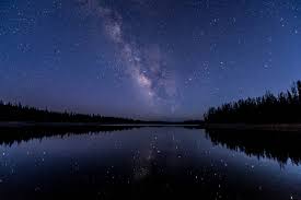 starry night sky over a river