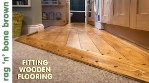 laying wooden flooring in a kitchen